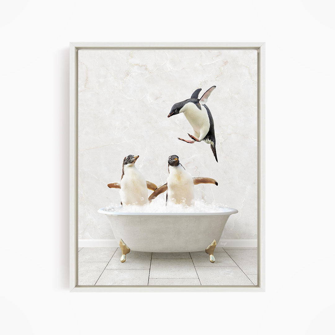 A framed image depicting two penguins sitting in a bathtub, with one penguin flying towards the other.