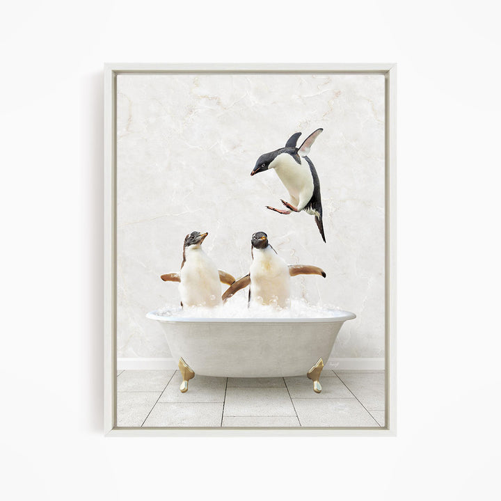 A framed image depicting two penguins sitting in a bathtub, with one penguin flying towards the other.