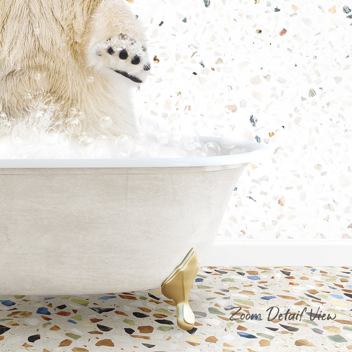 A white bathtub filled with bubbles, with a polar bear's paw in the water, and a colorful mosaic floor in the background.