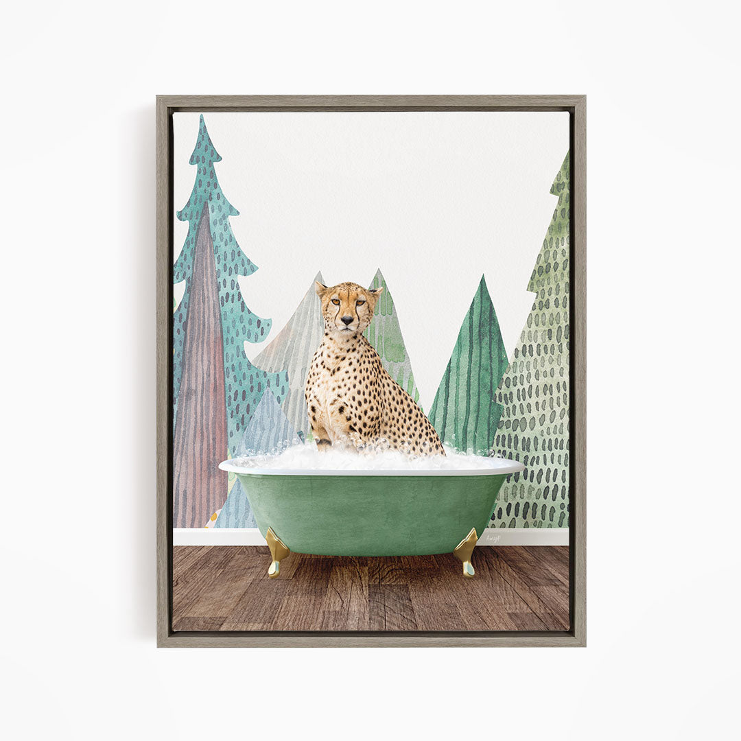 A cheetah is sitting in a green bathtub, surrounded by trees with a snowy landscape in the background.