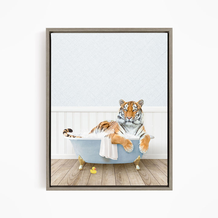 A tiger is sitting in a bathtub filled with water, surrounded by rubber ducks.