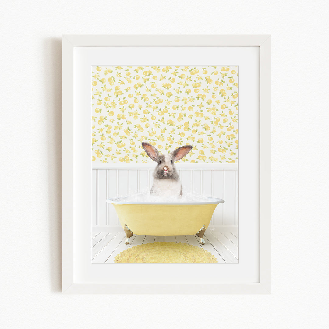 A white rabbit sitting in a yellow bathtub, surrounded by a yellow floral pattern on the wall behind it.