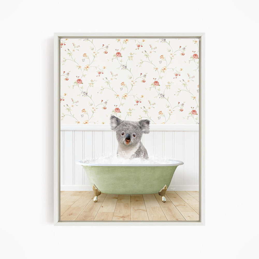 A koala bear sitting in a green bathtub filled with water, with a floral wallpaper in the background.