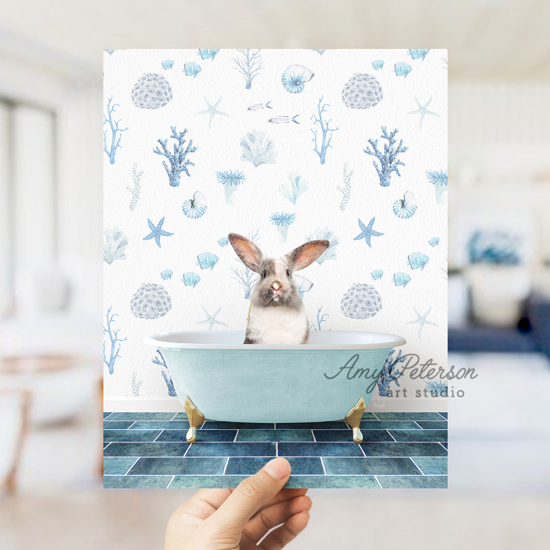 a person holding up a card with a picture of a bunny in a bathtub