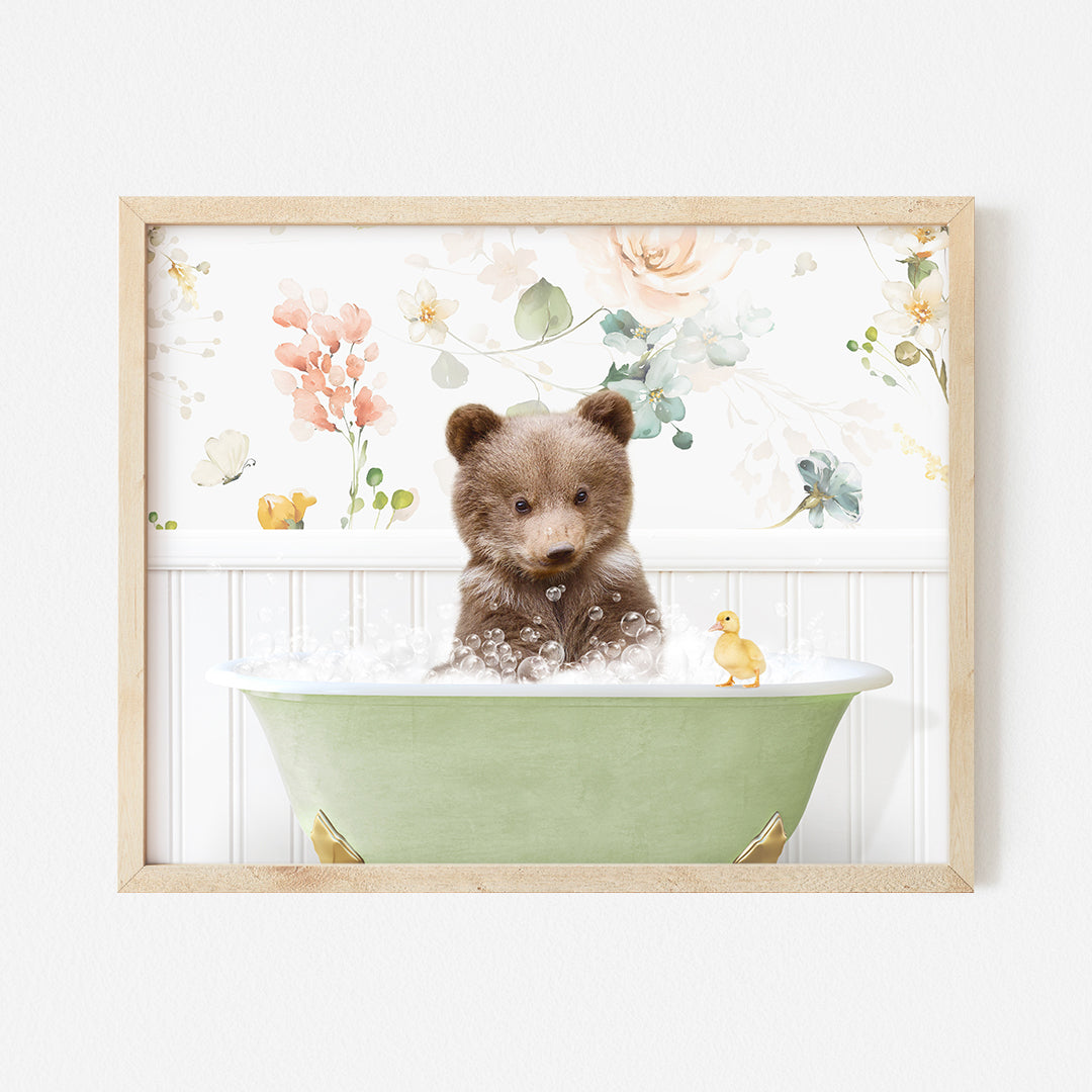 a brown teddy bear sitting in a green bath tub