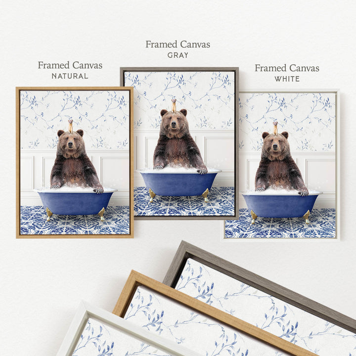a framed canvas with a brown bear sitting in a blue bathtub, surrounded by a floral pattern.