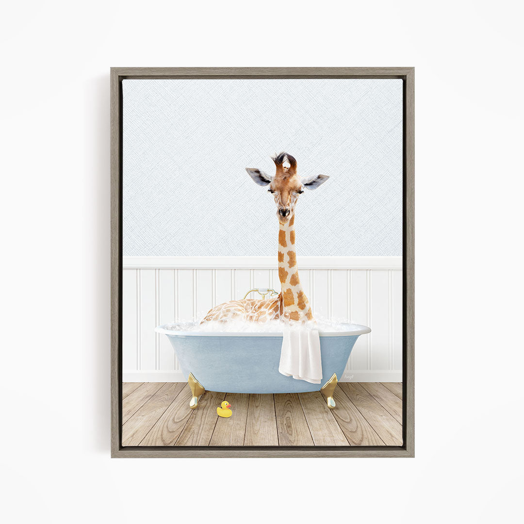 A giraffe is sitting in a blue bathtub filled with water, surrounded by rubber ducks.