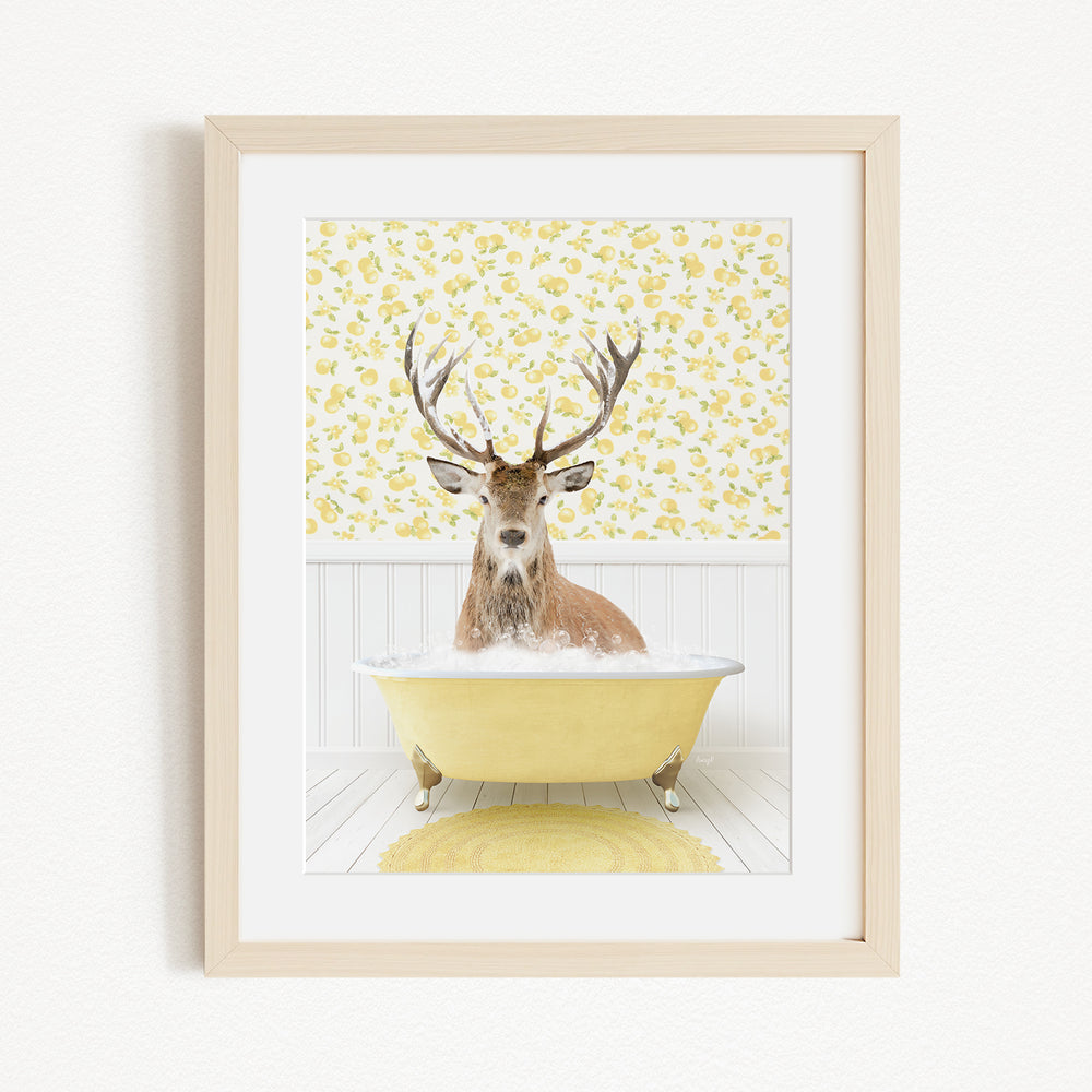 A deer with antlers is sitting in a yellow bathtub, surrounded by a yellow floral pattern on the wall behind it.