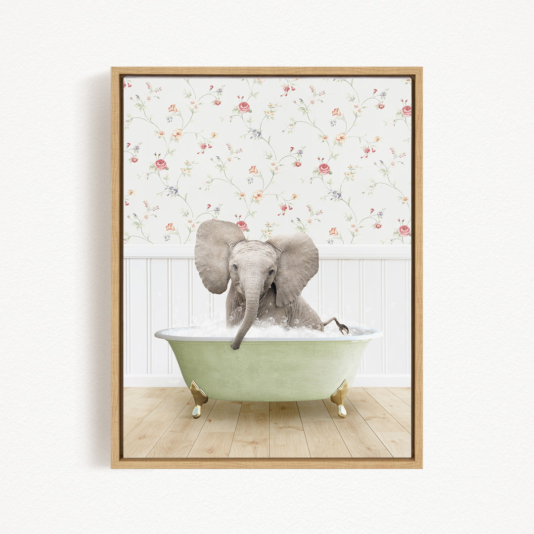 A gray elephant is sitting in a green bathtub filled with water, surrounded by a floral wallpaper.