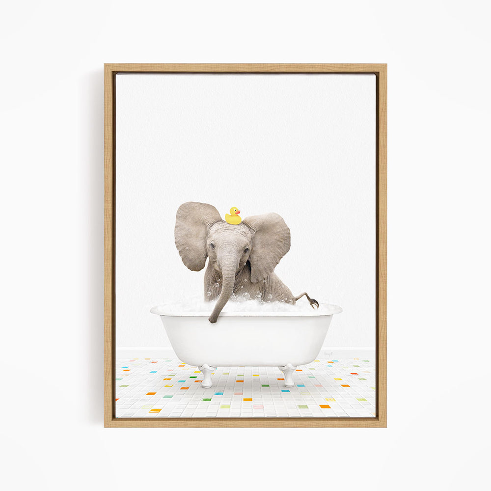 A baby elephant sitting in a white bathtub, with a yellow rubber duck on its head, enjoying a bath.
