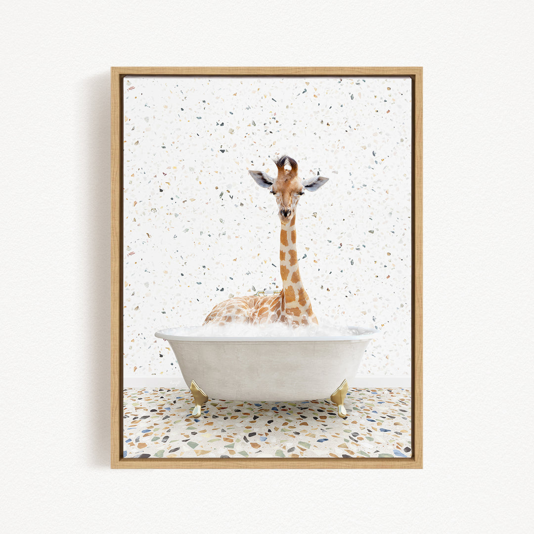 A giraffe sitting in a white bathtub filled with water, surrounded by a speckled tiled floor.