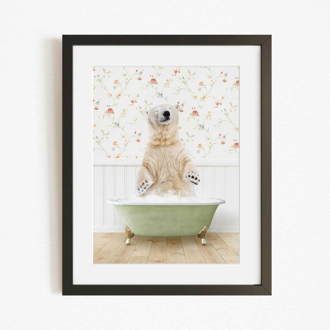 A polar bear sitting in a green bathtub filled with water, surrounded by a floral patterned wall.