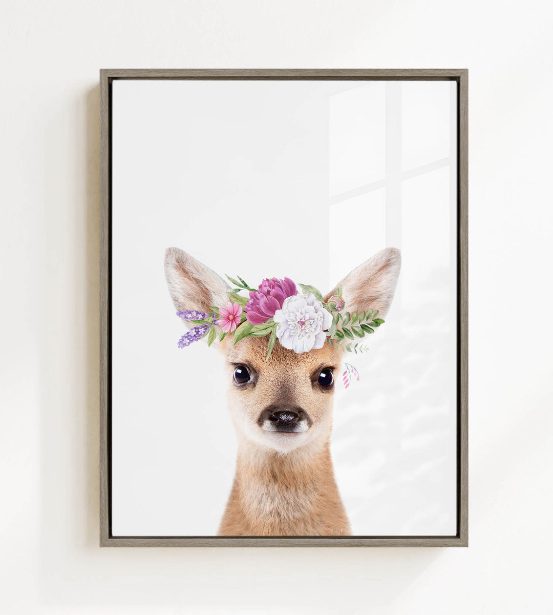 A deer wearing a flower crown on its head, with a white background.