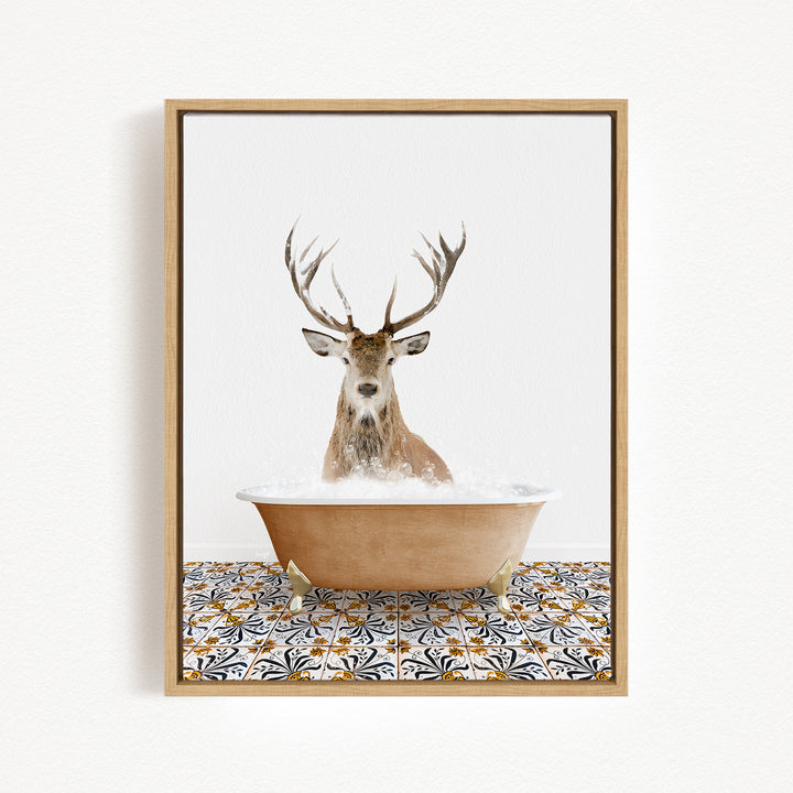 A deer with large antlers is sitting in a bathtub filled with water, creating a whimsical and unexpected scene.