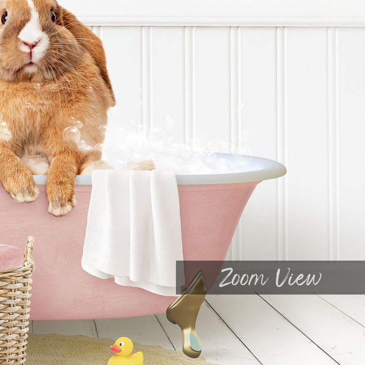 A cute orange rabbit sitting in a pink bathtub filled with bubbles, surrounded by a yellow rubber duck and a white towel.