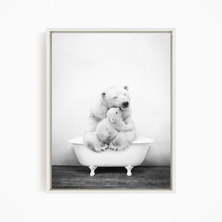 A black and white photograph of a mother polar bear sitting in a bathtub, with her cub resting on her lap.