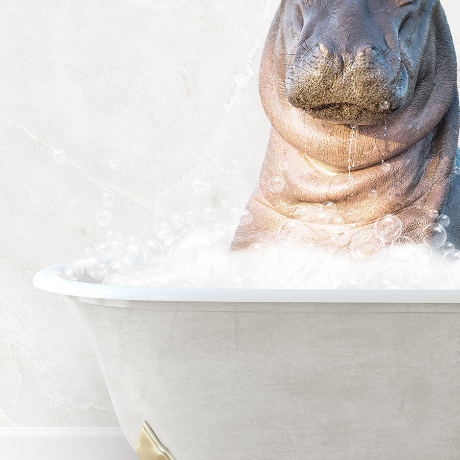 a hippopotamus sitting in a bathtub with bubbles