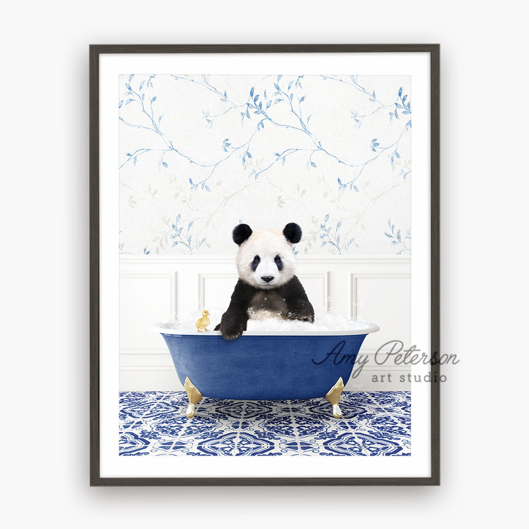 a panda bear sitting in a blue bath tub