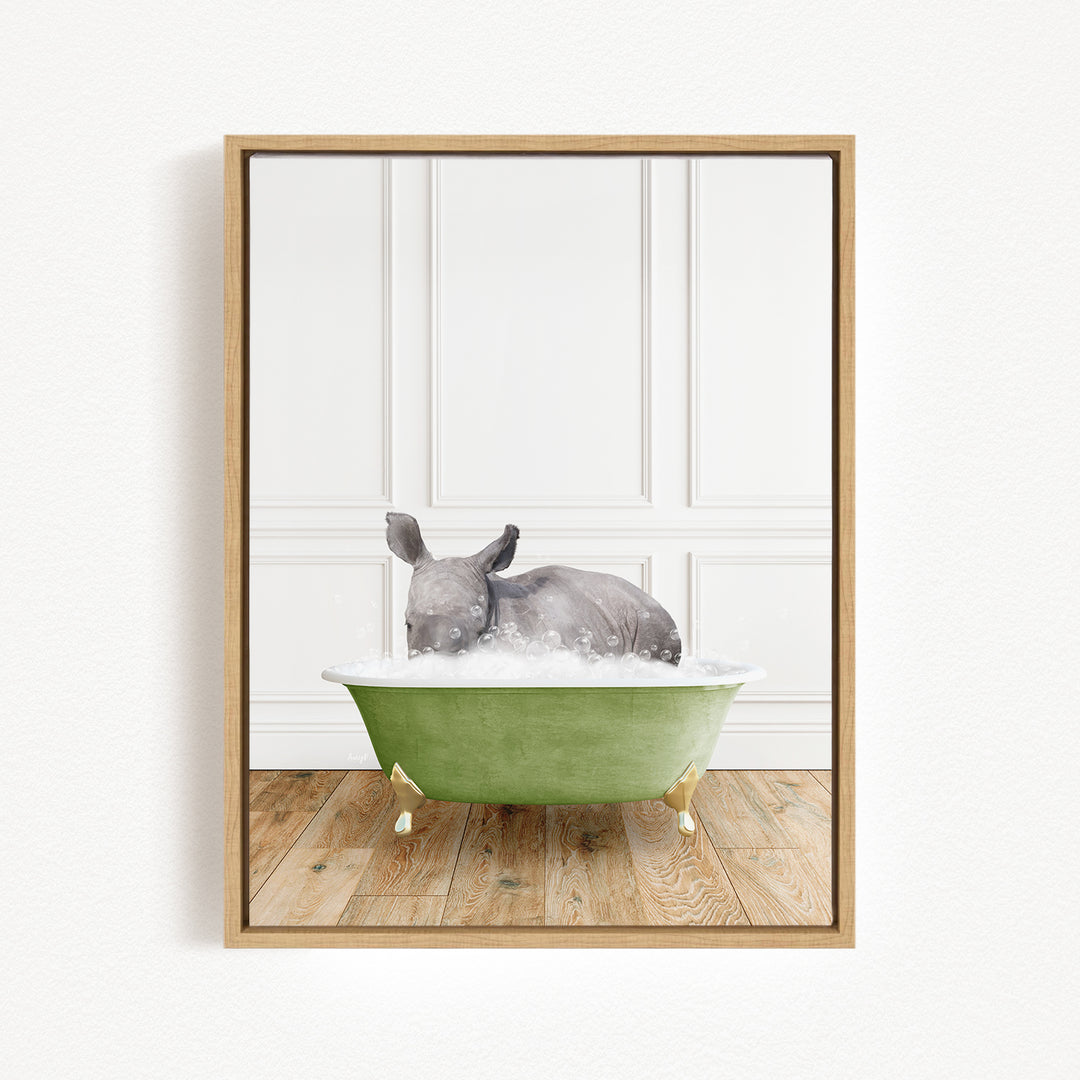 A gray rhinoceros is sitting in a green bathtub, surrounded by a white wall and wooden floor.