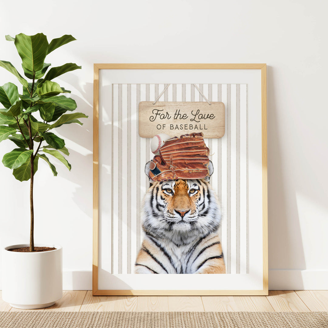 A framed poster featuring a tiger wearing a baseball cap and holding a baseball glove, with the text "For the Love of Baseball" written on it.