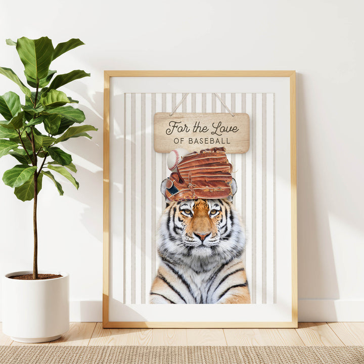 A framed poster featuring a tiger wearing a baseball cap and holding a baseball glove, with the text "For the Love of Baseball" written on it.