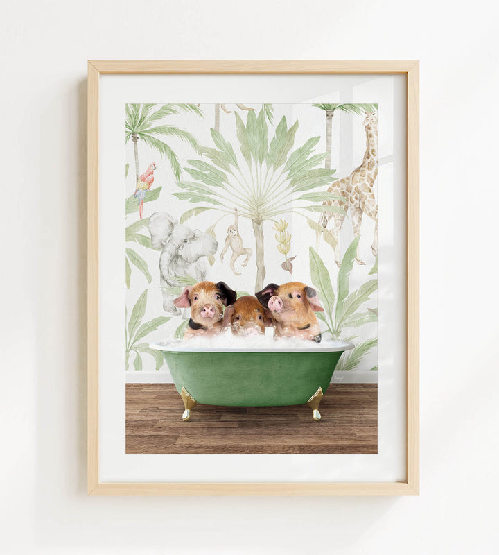 A framed print depicting three pigs sitting in a green bathtub, surrounded by a tropical jungle wallpaper.