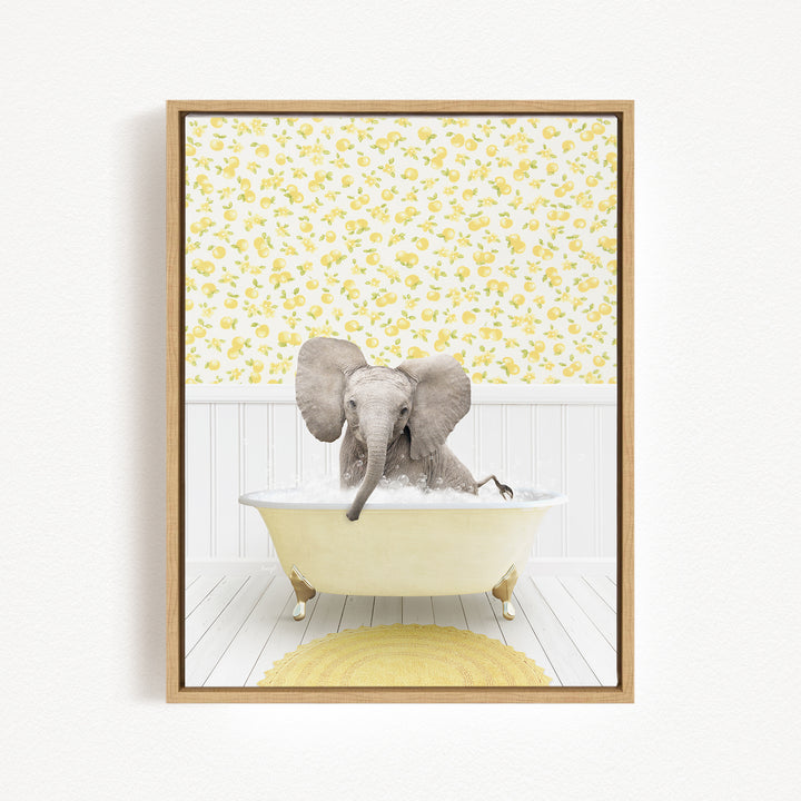 A gray elephant is sitting in a yellow bathtub filled with water, surrounded by a yellow floral pattern on the wall behind it.