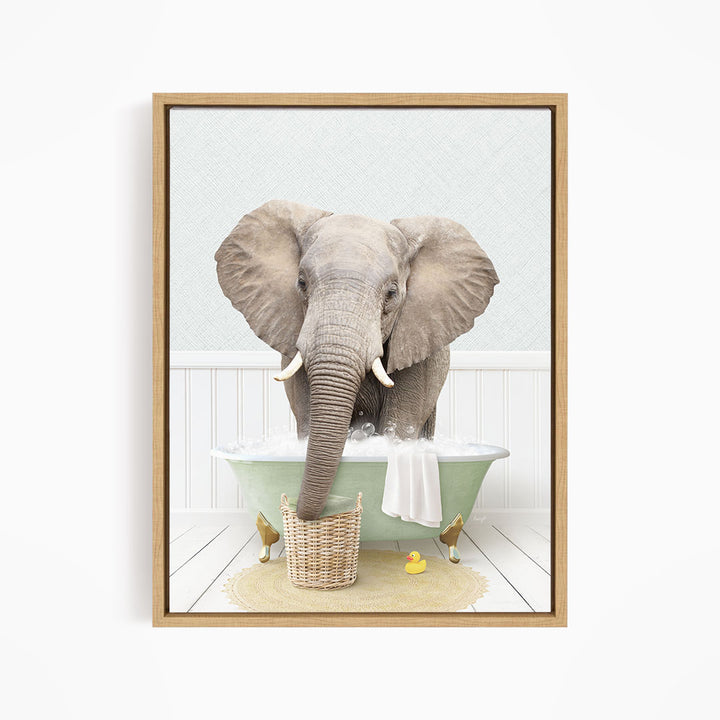 A gray elephant is standing in a green bathtub filled with water, surrounded by a yellow rubber duck and a basket.