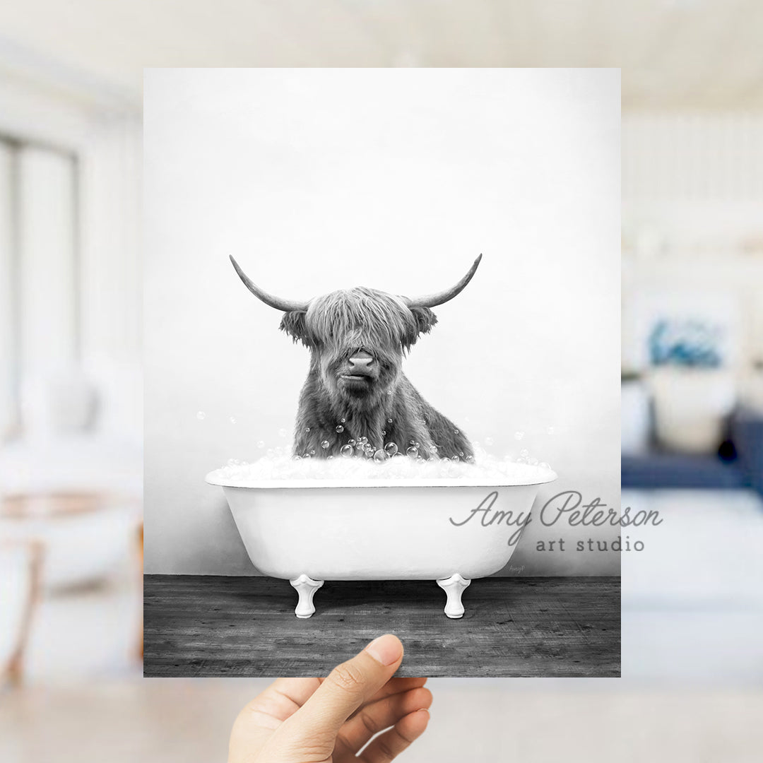 a black and white photo of a dog in a bathtub