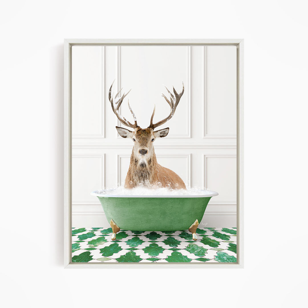 A deer with large antlers is sitting in a green bathtub filled with water, surrounded by a green and white patterned floor.
