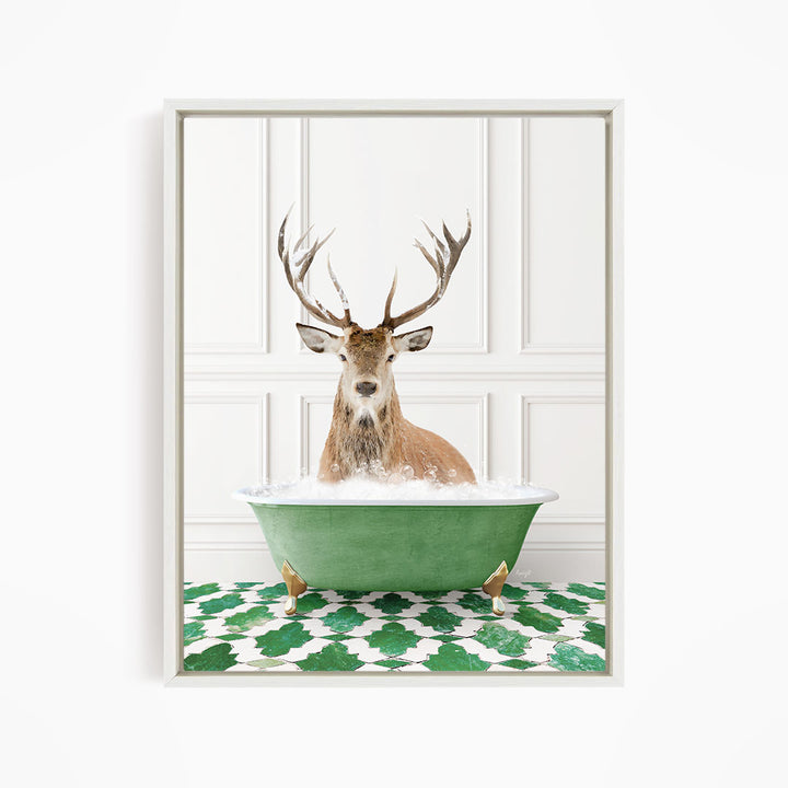 A deer with large antlers is sitting in a green bathtub filled with water, surrounded by a green and white patterned floor.