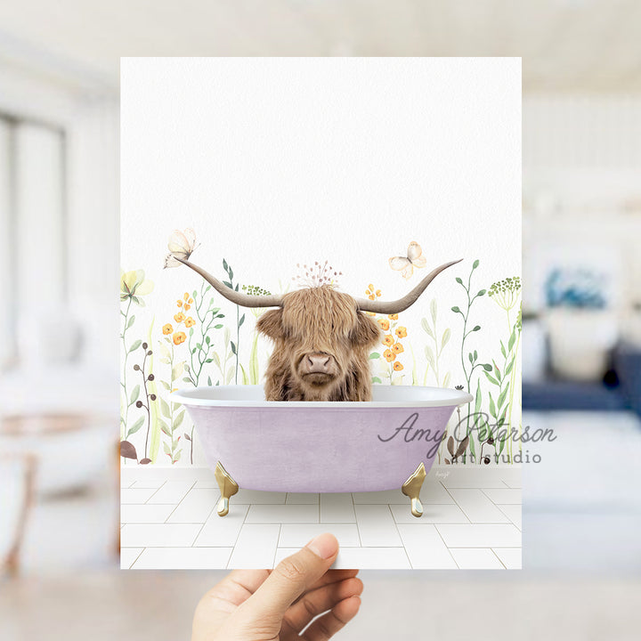 a person holding up a card with a picture of a cow in a bathtub