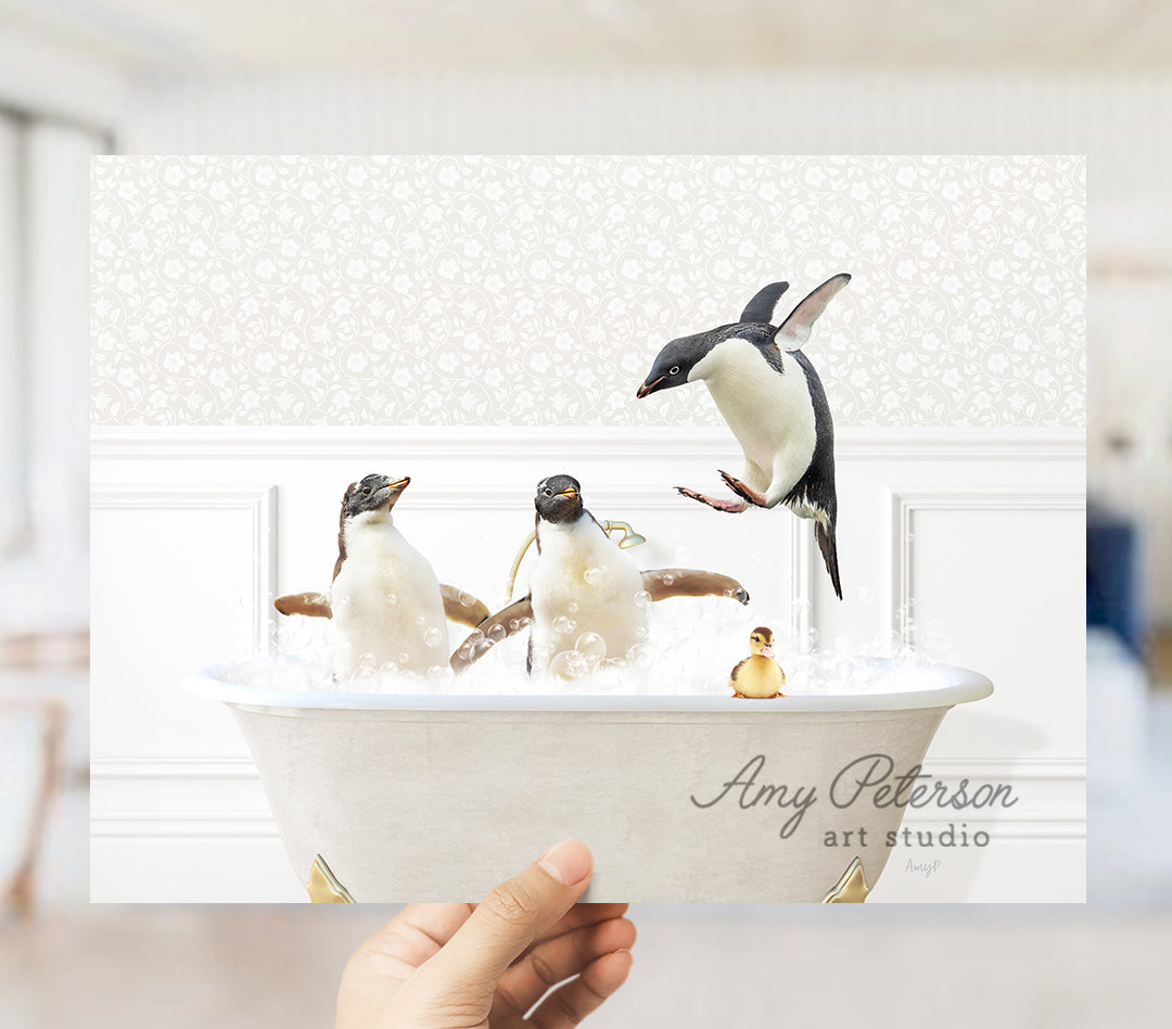 a person holding a bowl with penguins in it