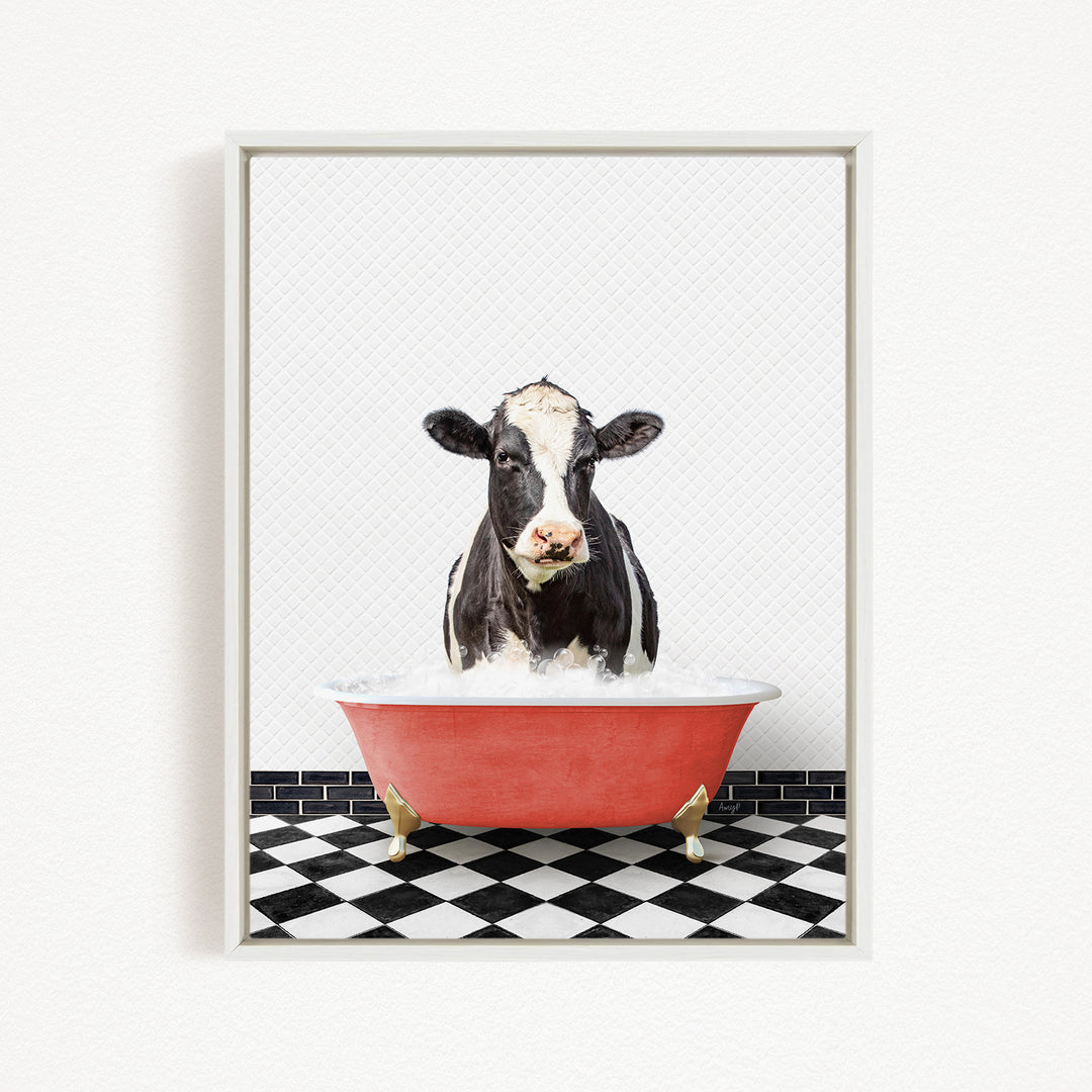 A black and white cow is sitting in a red bathtub filled with water, creating a whimsical and humorous scene.