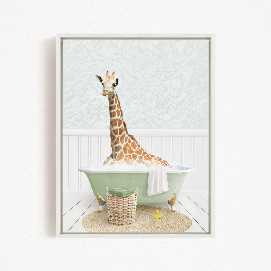 A giraffe sitting in a green bathtub filled with water, surrounded by a basket of toys and a yellow rubber duck.