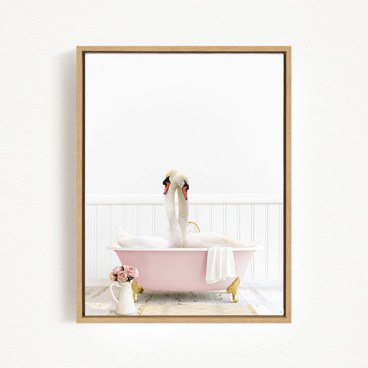 A pink bathtub filled with water, with two swans sitting inside. The swans have their heads above the water, and there is a vase of flowers and a white towel nearby.