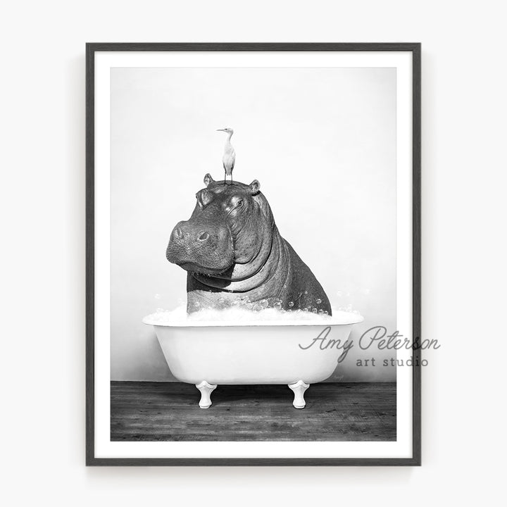 a black and white photo of a hippo in a bathtub