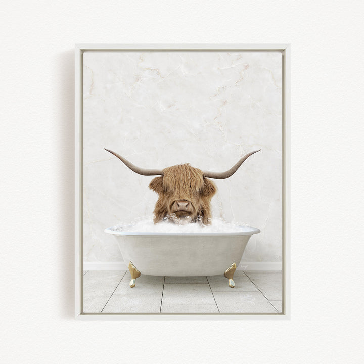 A Highland cow with long horns is sitting in a white bathtub filled with water, creating a whimsical and humorous scene.