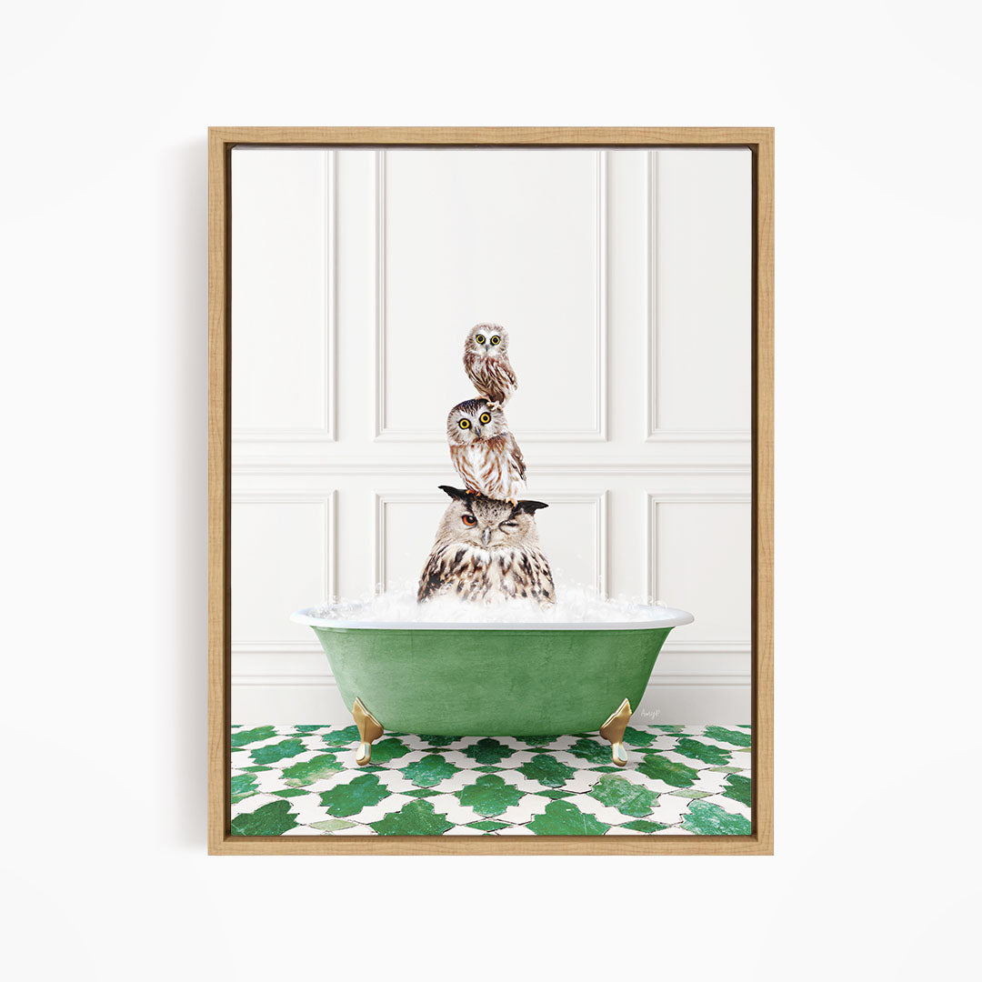 A framed image depicting a group of owls sitting in a green bathtub filled with water, creating a whimsical and playful scene.