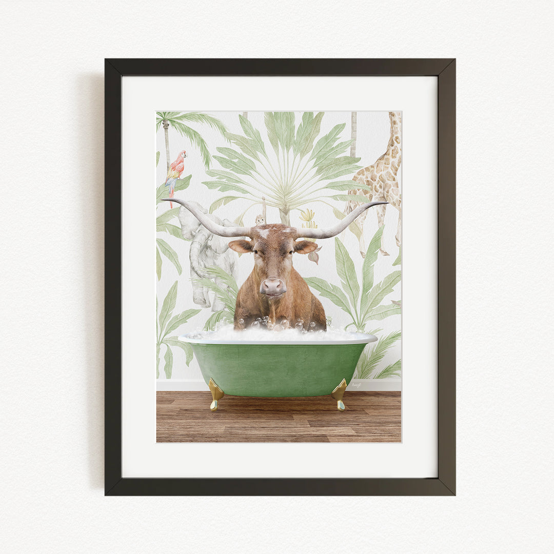 A framed image depicting a brown cow sitting in a green bathtub, surrounded by tropical foliage and a giraffe.