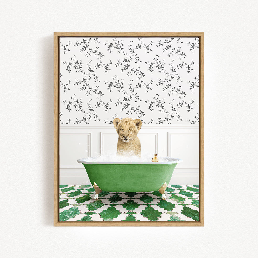 A young lion cub is sitting in a green bathtub filled with water, surrounded by a patterned wall and green and white tiles on the floor.