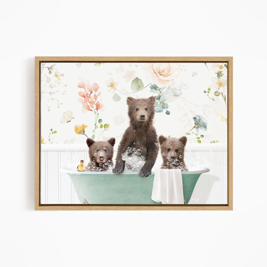 A framed image depicting three bears sitting in a green bathtub, surrounded by flowers and a floral pattern.
