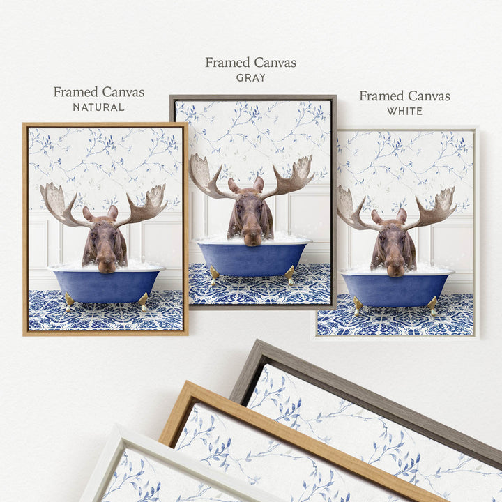 a framed canvas with a moose in a bathtub, surrounded by a blue and white floral pattern.