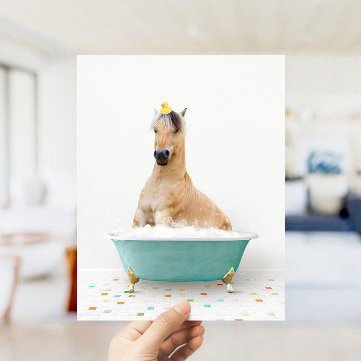 A horse sitting in a bathtub filled with bubbles, wearing a yellow rubber duck on its head.