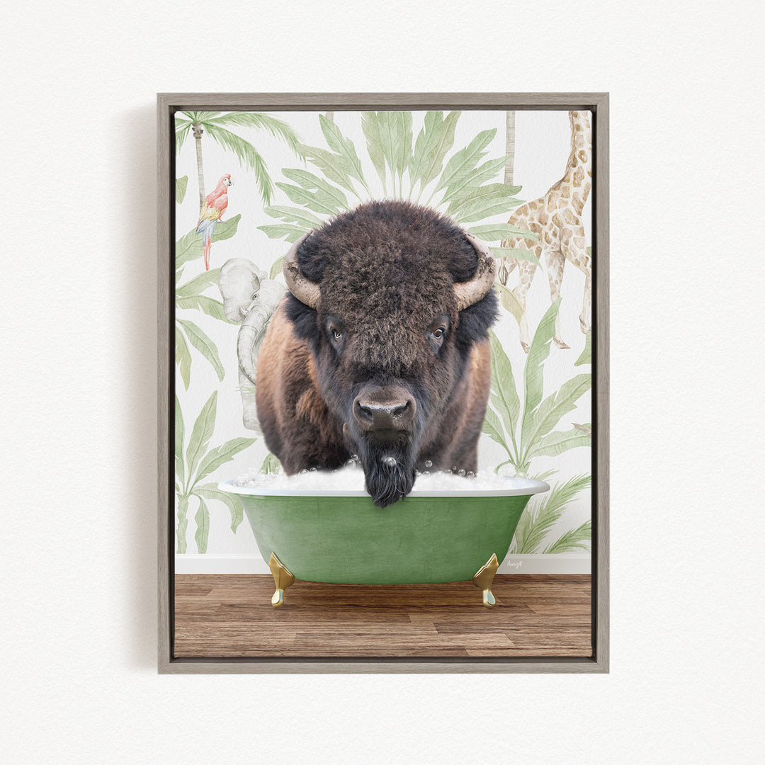 A buffalo is sitting in a green bathtub, surrounded by tropical foliage and a giraffe in the background.