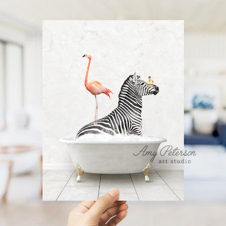 a hand holding a card with a zebra and a flamingo in a bathtub