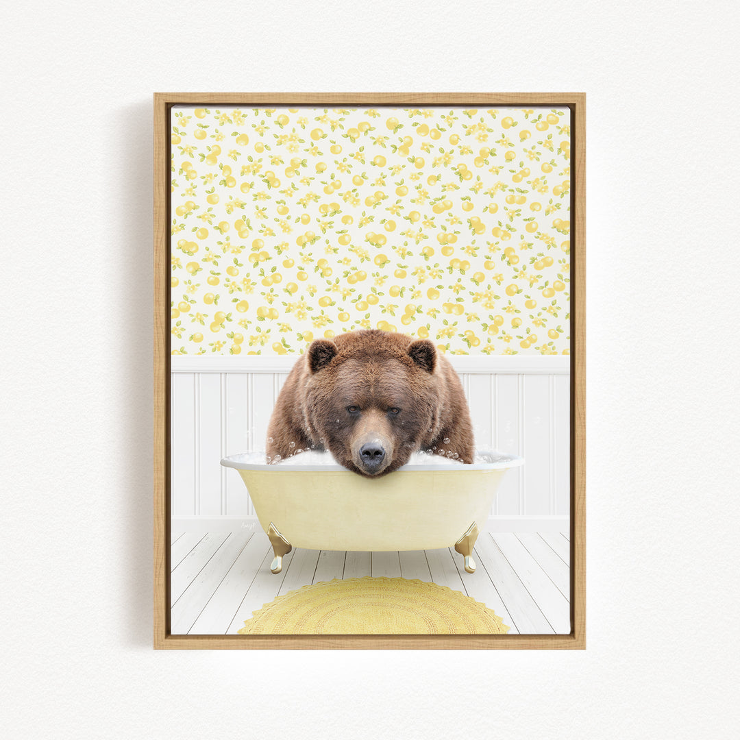 A brown bear is sitting in a white bathtub, surrounded by a yellow floral pattern on the wall behind it.
