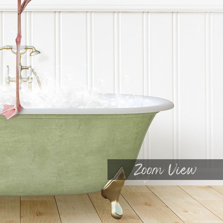 A green claw-foot bathtub filled with water, with a pink towel hanging on the side.