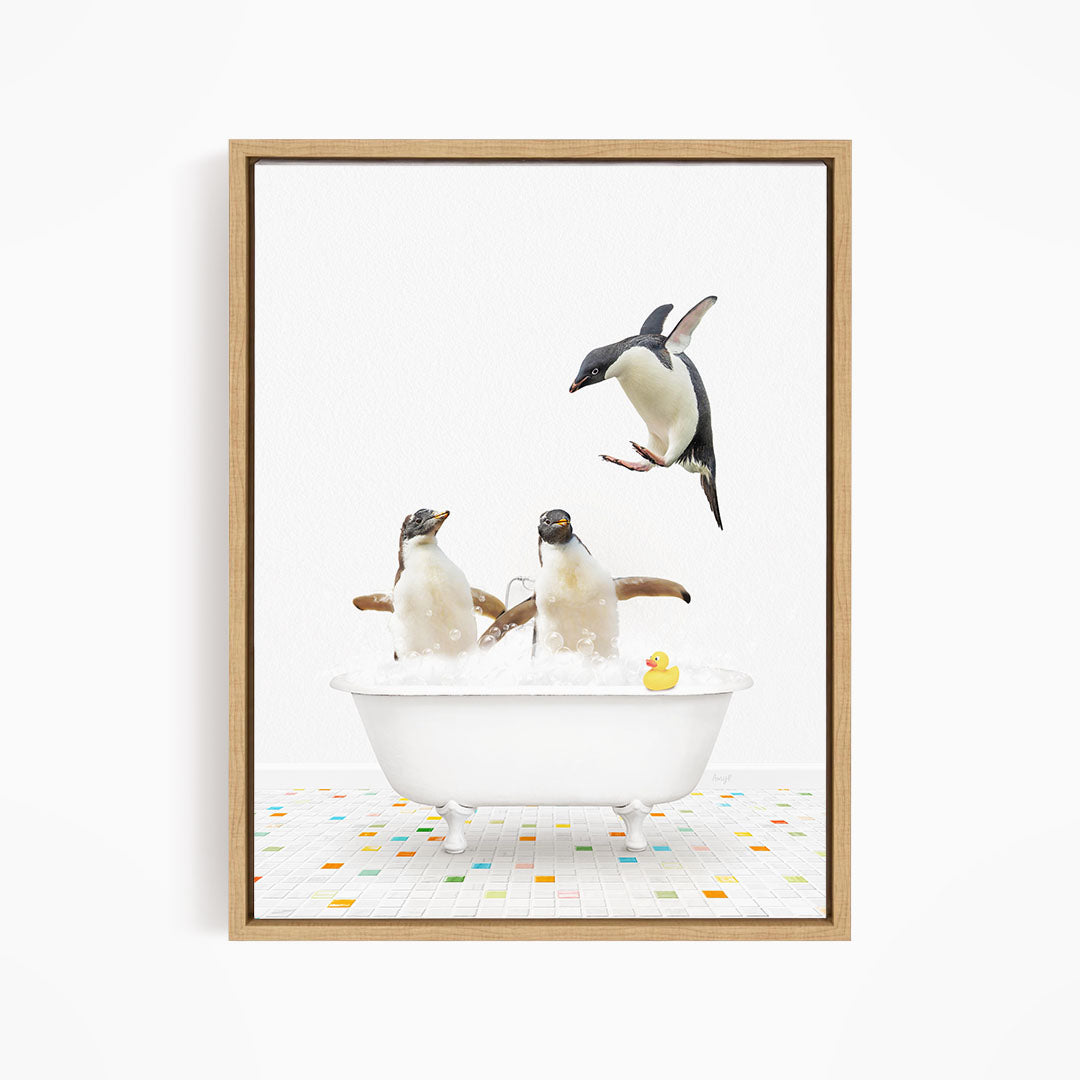 A framed image depicting three penguins sitting in a bathtub, with one penguin flying towards the others.