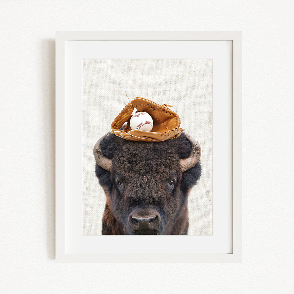 A buffalo with a baseball glove on its head.
